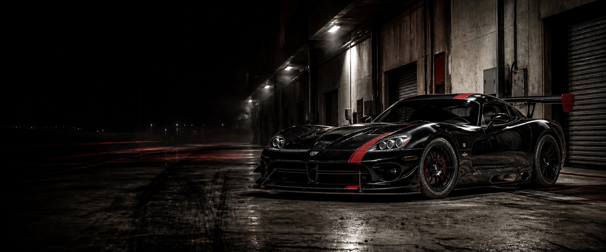 Black 2008 Dodge Viper ACR in a gritty industrial pit lane